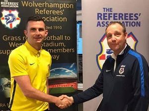 Supporting image for story: Michael Oliver is a big hit with the men in black