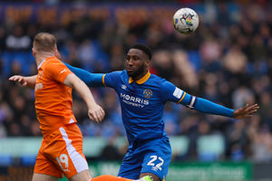Chey Dunkley of Shrewsbury Town and Shayne Lavery of Blackpool (AMA)