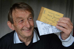 John holds his first book and his last book