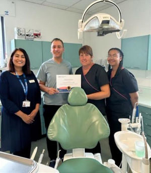 Anesha Chauhan (left) pictured with members of the Princes End Dental Practice team.