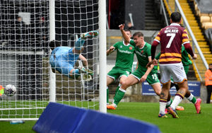 .Harry Lewis leaps for the ball but fails to stop Aramide Oteh's goal