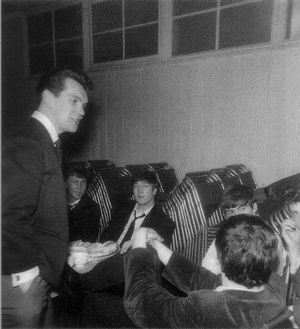 Jim Burgess, left, of Andre and the Electrons, chats with The Beatles.