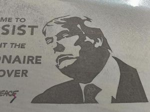 Supporting image for story: Donald Trump protest art created on beach near Turnberry golf resort