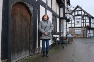 Mid Wales Journal reporter Karen Compton outside the Wobbly Badger and the door next door which became a main location for the film. Andy Compton image