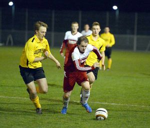 Ellesmere's Josh Parker and Wem's Dan Price.
Elesmere in yellow