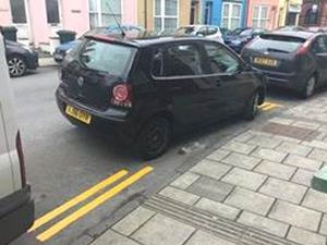 Supporting image for story: Council paints double yellow lines between parked cars
