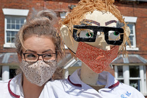 Hinstock is holding a scarecrow trail to keep kids entertained and raise money for good causes. The theme is 'lockdown heroes'. Pictured, Hinstock Manor care home care worker Laura Hartshorne meets her double