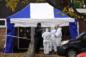 Police at the scene after the discovery of Mr Wallace's body