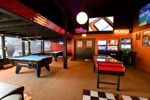 The gaming area is one of the numerous rooms set up in the bar