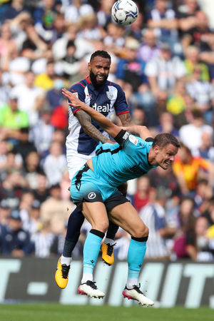 Kyle Bartley of West Bromwich Albion and Mathieu Smith of Millwall. (Photo: WBA)