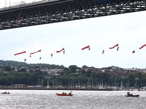 Supporting image for story: Forth Road Bridge closed as 10 Greenpeace activists abseil under it with flags