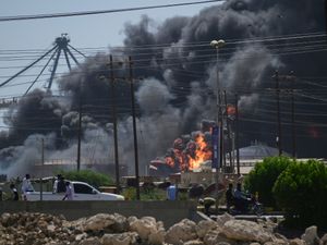 Smoke billows after drone strikes by the paramilitary Rapid Support Forces targeted the northern port in the Red Sea city of Port Sudan, Sudan
