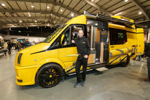 Dean Sharp of Central Motor Parts, from Pembrokeshire, next to his VW Crafter van - one of only four in the world, and the only one in yellow. Photo: Jason Sheldon/Junction10 Photography