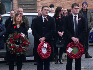 Mid and West Wales Senedd Member Jane Dodds, with Brecon and Radnorshire Senedd Member James Evans and Brecon, Radnor and Cwm Tawe MP David Chadwick holding their wreaths. Pic by Andy Compton