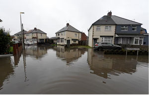 The floods had been going on in Jillian's street for years before it was finally solved. 