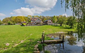Walnut Tree Cottage sits in more than six acres of land. Pictured is a pond. Picture: Savills.