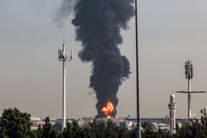 A smoke plume rises from an ongoing fire at Dubai International Airport in Dubai on March 16, 2026. (Photo by AFP via Getty Images) / 