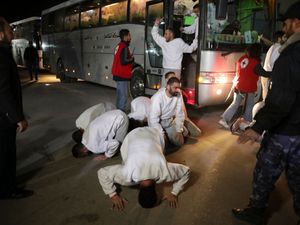 Freed Palestinians celebrate as they arrive in the Gaza Strip after being released from an Israeli prison