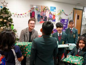 Supporting image for story: Generous boys make present donation to family hub