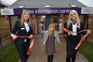 Isobel Hickman, with Taylor Wimpey sales executives Sam Banks and Molly Stephens