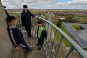 Karim, 10, Sami, 13, and Dani Al-Ayash, six, take a look at the view from the top of Lord Hill's Column