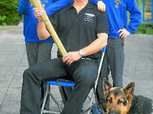 Supporting image for story: Olympic Flame fever as children cheer Blind Dave