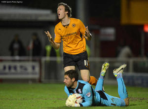Kevin McDonald of Wolverhampton Wanderers looks dejected as  Paul Jones of Crawley Town gathers the ball.