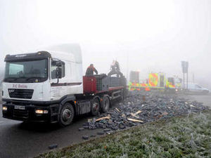 Supporting image for story: Traffic chaos as lorry sheds load