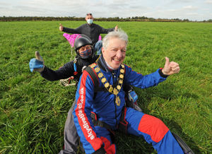 Safely back on land, following his skydive for the Samaritans, the mayor of Shrewsbury Phil Gillam, at Tilstock Airfield, Whitchurch, with tandem instructor Darrell Gibson, being supported by Samaritans volunteer Ricahrd Dunnill