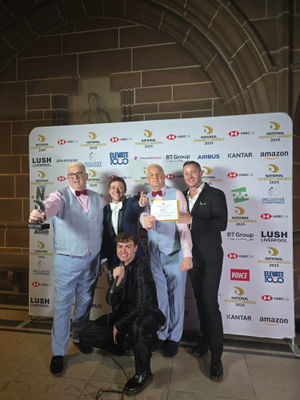 (L to R): Marcus Cotterill holding the trophy, Ash Palmisciano from Emmerdale,  Bradley Riches (kneeling down), Paul Ryder, and Austin Armacost 