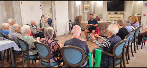 Residents at HC-One’s Lime Trees Care Home getting involved in armchair exercise session