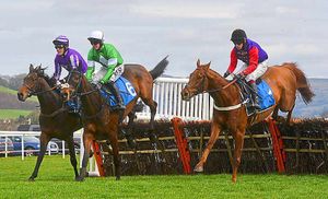 AP McCoy riding Slowfoot, jockey Richie McLernon riding Rainman (No 6) and jockey Peter Carberry riding Jack Frost (No 1).