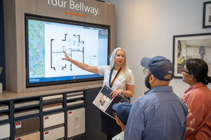 Sales advisor Olivia Ingles details the layout of a property to potential buyers