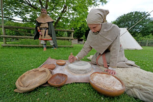 Emily Lambert uses the quern to make flour