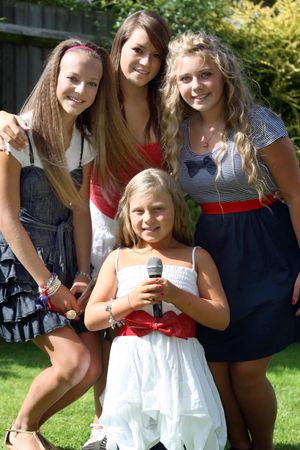 Tyne-Lexy, from Cannock, is the latest star on hit show Love Island – pictured aged 12 after her family made it to the second round in the 'GMTV No1 Sining Family' competition for a christmas number 1 album. 
L/R back Marni-Lee Clarson (15), Mia-Jay Clarson (17), Tyne-Lexy Clarson (12). Front Milla-Star Clarson (10) make up "Miss.C" group