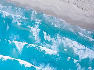 Aerial view of ocean surf on beach