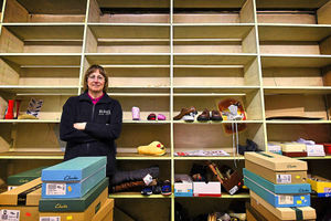 Manager Virginia Bourne stands amongst the empty shelves