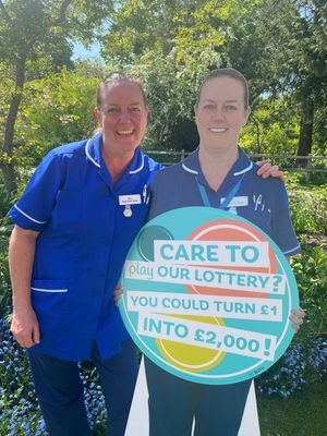 Nurse at Severn Hospice, Abi White (left) with the life-size cut-out.