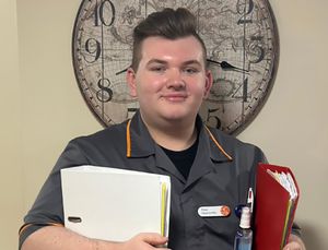 Finn Carragher, Senior Care Assistant at HC-One’s Dingle Meadow Care Home who is currently completing his Level 4 Lead Practitioner in Adult Care Apprenticeship 