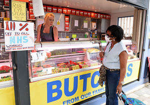 Butcher Katie Compton serves a customer