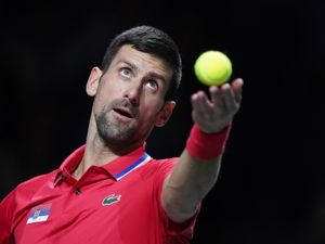 Novak Djokovic serves