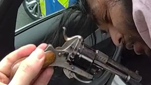 Video grab shows police finding a revolver in Tipton man Tammem Miah's bag.
