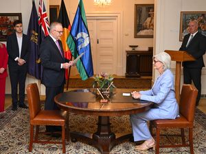 Australian Prime Minister Anthony Albanese, third left, is sworn into office by Australian Governor-General Sam Mostyn during a ceremony at Government House in Canberra