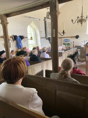 Inside Caebach Chapel listening to a service