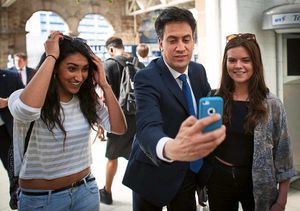 Labour leader Ed Miliband takes a selfie with rail passengers