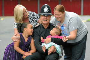 Sgt Ron Price with baby Alexei Kandare, Alexei's gran Susan Pettey, mother Hayley Haycock and six-year-old sister Ellie