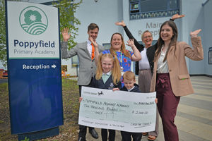 Poppyfield Primary Academy in Hednesford came third in our Cash for Schools competition. Pictured: headteacher Becky Scordis with pupils and sponsors.