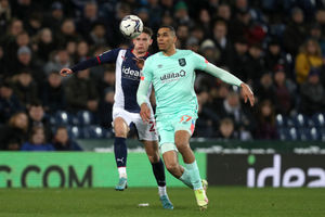 West Brom's Taylor Gardner-Hickman and Huddersfield Town's Jon Russell (Photo by Adam Fradgley/West Bromwich Albion FC via Getty Images).