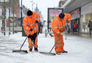 Council workers clearing snow in West Bromwich High Street
