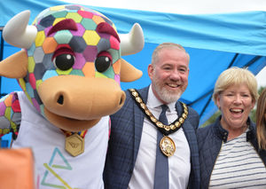 Chairman of Cannock Chase District Council councillor Martyn Buttery, and councillor Adrienne Fitzgerald, with 'Perry' the Games mascot